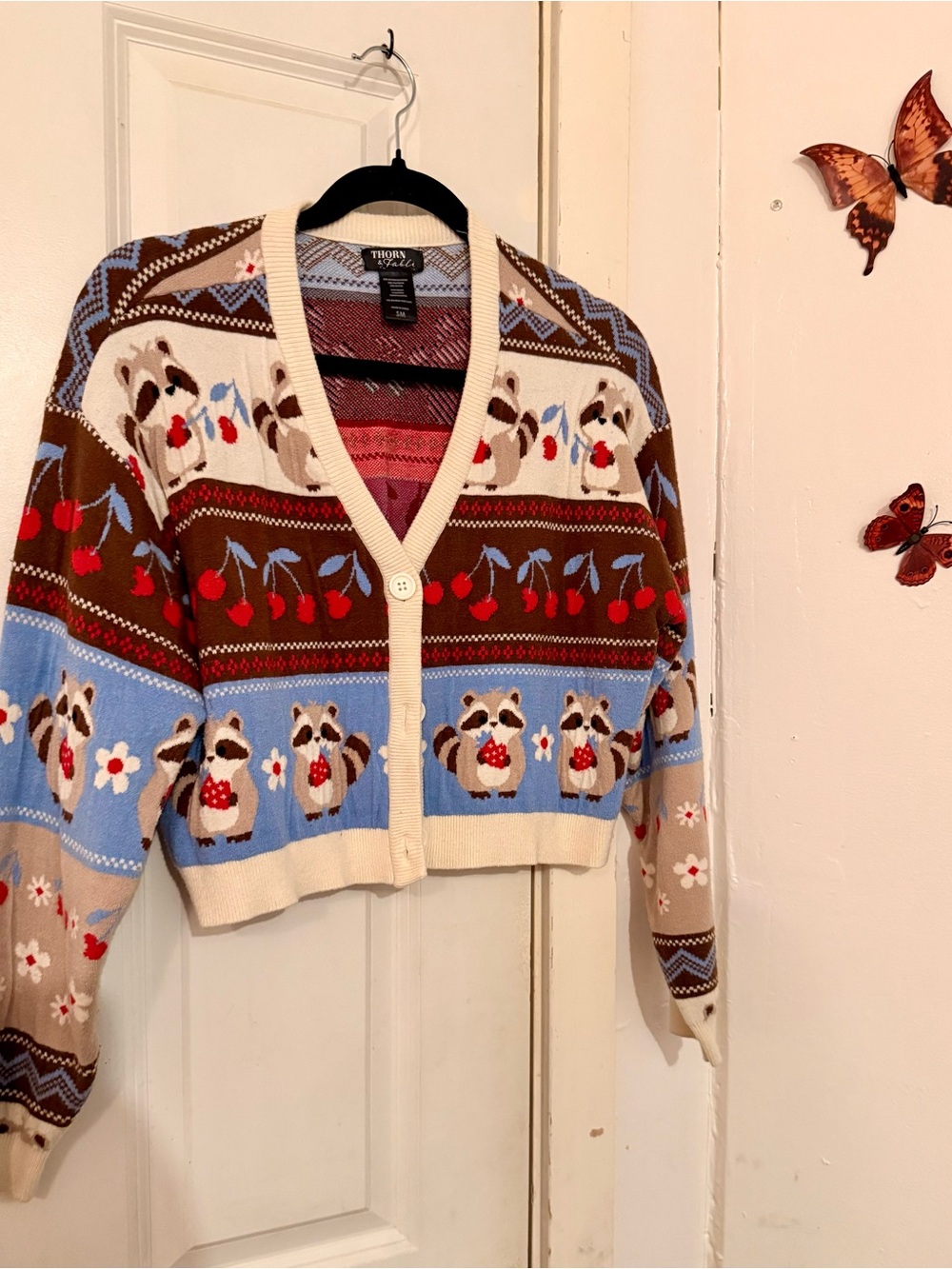 Thorn & Fable Blue and Brown Raccoon Pattern Cropped Cardigan Sweater